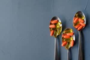 Multiple pills on spoons.